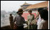 Mrs. Laura Bush listens as Mrs. Sarah Randt, spouse of the U.S. Ambassador to the People's Republic of China, leads a tour of the Forbidden City Friday, Aug. 9, 2008, in Beijing.