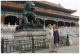 Mrs. Laura Bush and daughter Barbara Bush pause next to a Fu Dog during a visit Friday, Aug. 9, 2008, to the Forbidden City in Beijing.