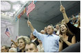 President George W. Bush, Mrs. Laura Bush and daughter Barbara Bush join the fans at the National Aquatics Center as they cheer on U.S. swimmer Michael Phelps as he swam his world-record setting 400-Meter Individual Medley event Sunday, Aug. 10, 2008, in Beijing.