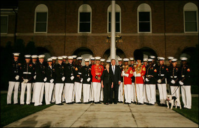 President George W. Bush and Laura Bush pose for a photograph with participants of the Evening Parade at the Marine Barracks Friday, August 29, 2008, in Washington D.C.