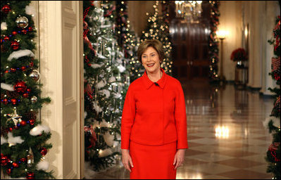 Mrs. Laura Bush stands in the East Room of the White House Wednesday, Dec. 3, 2008, as she reveals the 2008 White House holiday theme, "A Red, White and Blue Christmas" to approximately 120 members of the media during the White House Holiday Press Preview.