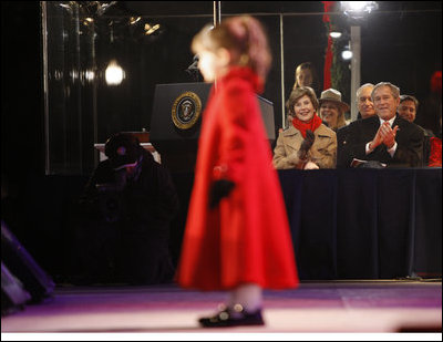 President George W. Bush and Mrs. Laura Bush watch four-year-old singer Kaitlyn Maher perform at the Pageant of Peace on the Ellipse Thursday, Dec. 4, 2008, prior to the lighting of the National Christmas Tree in Washington, D.C.