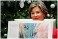 Mrs. Laura Bush shows off the illustrations in "My Penguin Osbert" Monday, Dec. 15, 2008, which she read to young patients and their families at Children's National Medical Center in Washington, D.C. Mrs. Bush explained that the book is about what you do when you write Santa a letter. Mrs. Bush also visited with patients and debuted the new Barney Cam VII: A Red, White & Blue Christmas for the kids.