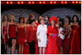 Mrs. Laura Bush is joined by singer/actress Liza Minnelli, left, her fellow celebrities, and fashion models participating in The Heart Truth Red Dress Collection 2008 fashion show in New York, Friday, Feb. 1, 2008. Heart Truth is a national awareness campaign that warns women of the dangers of heart disease.