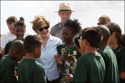 Mrs. Laura Bush visits with Florida City Elementary School students Wednesday, Feb. 6, 2008, during the Junior Ranger "First Bloom" planting event in Everglades National Park, Fla. President Bush on Monday asked Congress to spend $215 million for restoration of the Everglades.