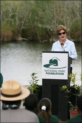 Mrs. Laura Bush addresses students and guests Wednesday, Feb. 6, 2008, during the Junior Ranger "First Bloom" planting event in Everglades National Park, Florida, praising a program to help bring back native trees in areas of the Everglades overgrown with non-native plants.