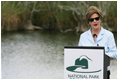 Mrs. Laura Bush addresses students and guests Wednesday, Feb. 6, 2008, during the Junior Ranger "First Bloom" planting event in Everglades National Park, Florida, praising a program to help bring back native trees in areas of the Everglades overgrown with non-native plants.