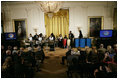 President George W. Bush and Mrs. Laura Bush watch as the St. Veronicas Youth Steel Orchestra performs at the Helping America's Youth Event Thursday Feb. 7, 2008, in the East Room of the White House.