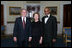 President George W. Bush and First Lady Laura Bush pose for photos with actor Avery Brooks prior to a ceremony in the East Room of the White House honoring Abraham Lincoln's 199th Birthday, Sunday, Feb. 10, 2008.