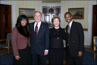 President George W. Bush and First Lady Laura Bush pose for photos with Lincoln Medal winner Dr. Benjamin Carson and his wife Candy Carson prior to a ceremony in the East Room of the White House honoring Abraham Lincoln's 199th Birthday, Sunday, Feb. 10, 2008.