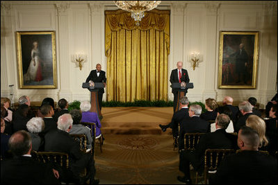 President George W. Bush and First Lady Laura Bush listen as Actor Avery Brooks, (L), and Dr. Allen Guelzo make remarks during a ceremony in the East Room of the White House honoring Abraham Lincoln's 199th Birthday, Sunday, Feb. 10, 2008.