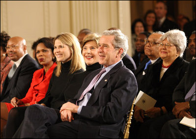 President George W. Bush, Mrs. Laura Bush, Jenna Bush and Secretary of State Condoleezza Rice join the East Room audience in listening to The Temptations Tuesday, Feb. 12, 2008, during a celebration of African American History Month.