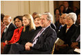 President George W. Bush, Mrs. Laura Bush, Jenna Bush and Secretary of State Condoleezza Rice join the East Room audience in listening to The Temptations Tuesday, Feb. 12, 2008, during a celebration of African American History Month.