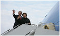 President George W. Bush and Mrs. Laura Bush wave from Air Force One as they board the aircraft Friday, Feb. 16, 2008, at Andrews Air Force Base en route to Benin, the first stop on their five-country, African visit.