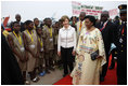 Mrs. Laura Bush and Madame Chantal de Souza Yayi, First Lady of Benin, walk the red carpet upon the arrival Saturday, Feb. 16, 2008, of Mrs. Bush and President George W. Bush to Benin.