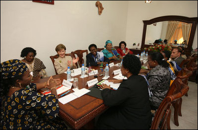 Mrs. Laura Bush participates in a roundtable discussion with faith-based HIV/AIDS Prevention Program graduates Sunday, Feb. 17, 2008, at Karimjee Hall in Dar es Salaam, Tanzania. Mrs. Bush reconfirmed America’s commitment to the Tanzanian people and their continued efforts against HIV/AIDS. At left is Mrs. Salma Kikwete, First Lady of Tanzania.