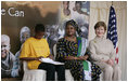 Mrs. Laura Bush and Mrs. Salma Kikwete, First Lady of Tanzania, enjoy Salvation Army Children as they perform on stage Sunday, Feb. 17, 2008, at the WAMA Foundation in Dar es Salaam. The foundation, founded by Mrs. Kikwete, is a non-profit organization focusing on development by improving women’s social and economic status by redefining gender roles and creating more opportunities for the development of women and children.