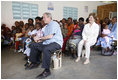 President George W. Bush and Mrs. Laura Bush join children and their families during a welcoming program Monday, Feb. 18, 2008, at the Maasai Girls School in Arusha, Tanzania.