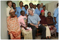 President George W. Bush and Mrs. Laura Bush pose for a photo Monday, Feb. 18, 2008, with patients and staff at the Meru District Hospital outpatient clinic in Arusha, Tanzania.