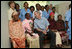 President George W. Bush and Mrs. Laura Bush pose for a photo Monday, Feb. 18, 2008, with patients and staff at the Meru District Hospital outpatient clinic in Arusha, Tanzania.