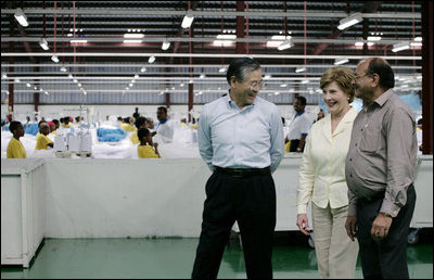 Mrs. Laura Bush speaks with the management representatives of A to Z Textiles Monday, Feb. 18, 2008, in Arusha, Tanzania, where workers stitch mosquito nets in the fight against malaria.