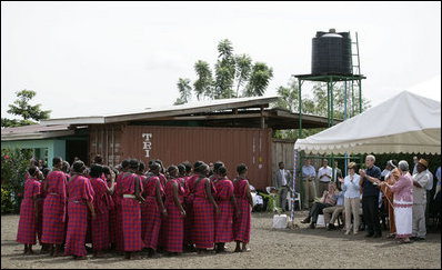 President George W. Bush and Mrs. Laura Bush applaud a dance performance Monday, Feb. 18, 2008, at the Maasai Girls School in Arusha, Tanzania.