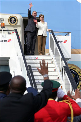 President George W. Bush and Mrs. Laura Bush wave from the steps of Air Force One Feb. 19, 2008, as they depart from Julius Nyerere International Airport in Dar es Salaam, Tanzania. The President and Mrs. Bush are on their way to Rwanda, the third stop of their five-nation tour.