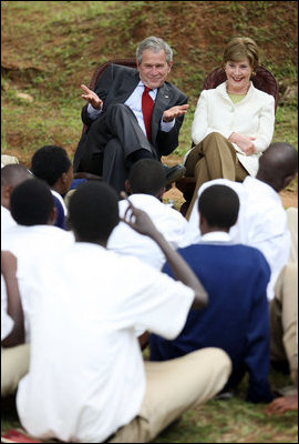 President George W. Bush and Mrs. Laura Bush react during a discussion with members of the Lycee de Kigali 'Anti-AIDS Club' Tuesday, Feb. 19, 2008, outside of the Lycee de Kigali in Kigali, Rwanda.