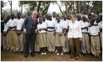President George W. Bush and Mrs. Laura Bush pose for a photo with the Lycee de Kigali students Tuesday, Feb. 19, 2008 in Kigali, Rwanda.