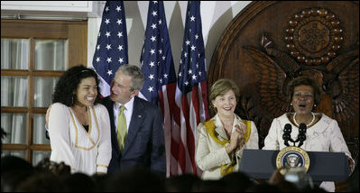 President George W. Bush congratulates singer Jordin Sparks after she sang the U.S. National Anthem Wednesday, Feb. 20, 2008, during the welcome for President Bush and Mrs. Laura Bush to the U.S. Ambassador's Residence in Accra, Ghana, by Ambassador Pamela Bridgewater.