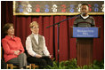 Mrs. Laura Bush and Dr. Tish Howard, Principal, Washington Mill Elementary School, listen as Damien Floyd, Student, reads an essay he wrote on George Washington, during a Mount Vernon's "George Washington's Return to School" ceremony at Washington Mill Elementary School Tuesday, January 15, 2008, in Alexandria, Virginia. The "Portrait of Leadership" initiative was planned to coincide with the 275th birthday year of George Washington, celebrated in February of 2007, to help put a portrait of George Washington in class rooms in all fifty states.