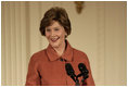 Mrs. Laura Bush speaks to the audience Monday, Jan. 28, 2008, during the President's Committee on the Arts and the Humanities Coming Up Taller awards ceremony in the East Room of the White House. Mrs. Bush told her audience, "The Coming Up Taller award winners have made a demonstrable impact on the lives of children, many of whom need extra attention from caring adults to help them stay on track for a healthy and successful life."