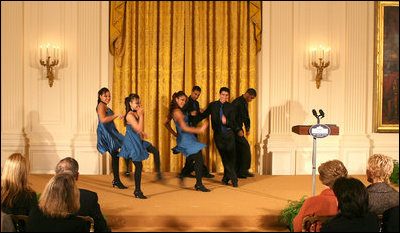 Ritmo en Accion, from Jamaica Plain, Massachusetts, performs during the Coming Up Taller awards ceremony Monday, Jan. 28, 2008, in the East Room of the White House. The youth dance initiative was created in 2001 by the Hyde Square Task Force to combat high crime, violence and low student achievement in its tough, inner-city Boston neighborhood.