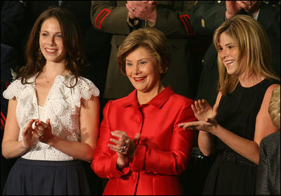 Mrs. Laura Bush, joined by her daughters, Barbara, left, and Jenna applaud from the First Lady's box at the U.S. Capitol, as President George W. Bush delivers his State of the Union Address Monday, Jan. 28, 2008.