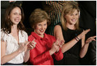 Mrs. Laura Bush and her daughters, Barbara, left, and Jenna applaud from the First Lady's box at the U.S. Capitol, as President George W. Bush delivers his State of the Union Address Monday, Jan. 28, 2008.