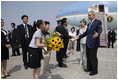 President George W. Bush and Laura Bush are welcomed on their arrival Sunday, July 6, 2008 to the New Chitose International Airport, to attend the Group of Eight Summit in Toyako, Japan.