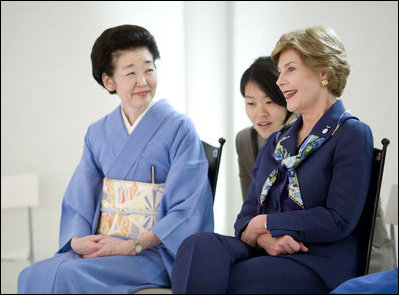 Mrs. Laura Bush smiles as she joins Mrs. Kiyoko Fukuda, left, spouse of Japan's Prime Minister Yasuo Fukuda, and other G-8 spouses at a traditional Japanese cultural program Monday, July 7, 2008, at the Windsor Hotel Toya Resort and Spa in Toyako, Japan.