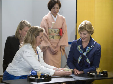 Mrs. Laura Bush watches as Mrs. Svetlana Medvedeva prepares a bowl of tea Monday, July 7, 2008 during a program in Toyako, Japan, for G-8 spouses on traditional Japanese culture. Mrs. Medvedev is the spouse of Russia's President Dmitriy Medvedev.