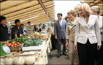Mrs. Laura Bush joins spouses of the G-8 leaders as they visit the Hokkaido Marche (northern farm market), in Makkari Village Tuesday, July 8, 2008. The Hokkaido Marche was especially organized by the local residents on the occasion of the Summit, with the aim of illustrating the richness of locally produced foods.