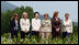 With Mt. Yoteizan as a backdrop, the G-8 Spouses pause Tuesday, July 8, 2008, for their family photo in the village of Makkari on the northern Japanese island of Hokkaido.