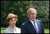 President George W. Bush and Mrs. Laura Bush meet with reporters Sunday, July 13, 2008 upon their arrival back to the White House, to express their sadness on the death of former White House Press Secretary Tony Snow.