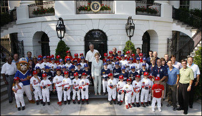 President George W. Bush and Mrs. Laura Bush stand with the All-Star Tee Ball teams and participants on the South Portico Wednesday, July 16, 2008, following a double-header at the White House with pitting Eastern U.S. against Central U.S. and Southern U.S. against Western U.S.