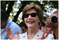 Mrs. Laura Bush shows her enthusiasm for the spirited game of tee ball as young All-Star players from across the United States gather to play on the White House South Lawn on July 16, 2008. President George W. Bush watched the game a few seats away on a bleachers set up for the event for the young players.