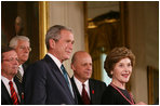 President George W. Bush is introduced to the podium by Mrs. Laura Bush Wednesday, July 30, 2008 in the East Room of the White House, prior to signing H.R. 5501, the Tom Lantos and Henry J. Hyde United States Global Leadership Against HIV/AIDS, Tuberculosis and Malaria Reauthorization Act of 2008.