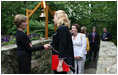 Mrs. Laura Bush greets the directors of Presidential Libraries Wednesday, June 4, 2008, at the entrance to Camp David's Evergreen Chapel in Thurmont, Maryland. Mrs. Bush shakes hands with Ms. Nancy Smith, Director of the National Archives' Presidential Material Staff in Alexandria, VA.