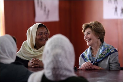 Mrs. Laura Bush smiles as she meets Sunday, June 6, 2008, with female graduates of the Police Training Academy in Bamiyan province in Afghanistan. With her is Bamiyan Governor Habiba Sarabi.