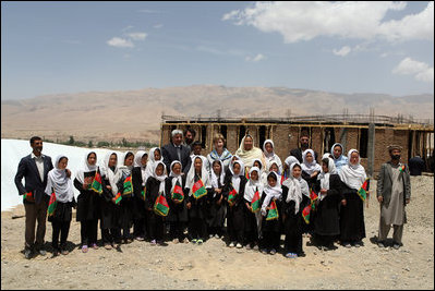 Mrs. Laura Bush is joined by Habiba Sarabi, Governor of Bamiyan Province, right, and students of the Ayenda Learning Center Sunday, June 8, 2008, during a tour of the school's construction site in Bamiyan, Afghanistan. 