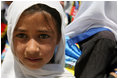 A young girl is seen outside of the Ayenda Learning Center during Mrs. Bush's visit Sunday, June 8, 2008, in Bamiyan, Afghanistan. 