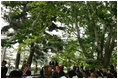 Under the boughs of the trees of Gul Khana Palace, Mrs. Laura Bush delivers remarks Sunday, June 8, 2008, during a press availability with President Hamid Karzai of Afghanistan in Kabul.
