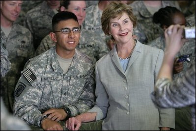 Mrs. Laura Bush poses for a photo with a US soldier during her visit to Bagram Air Force Base Sunday, June 8, 2008, in Bagram, Afghanistan.